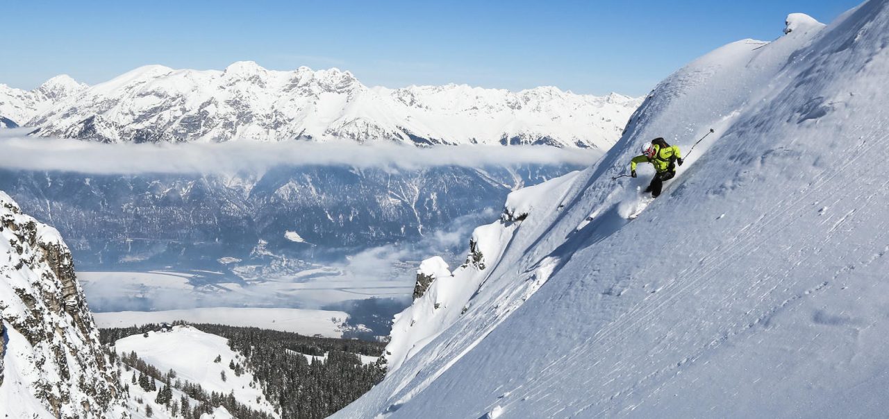 Steep skiing above valley