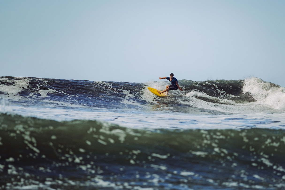 Guy in Costa Rica catching waves.